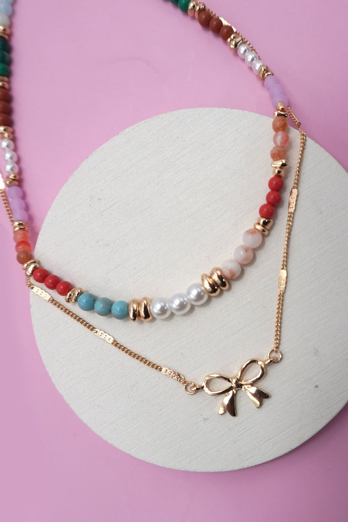 MULTI BEADED BOW CHARM DOUBLE LAYER NECKLACE | 80N91498