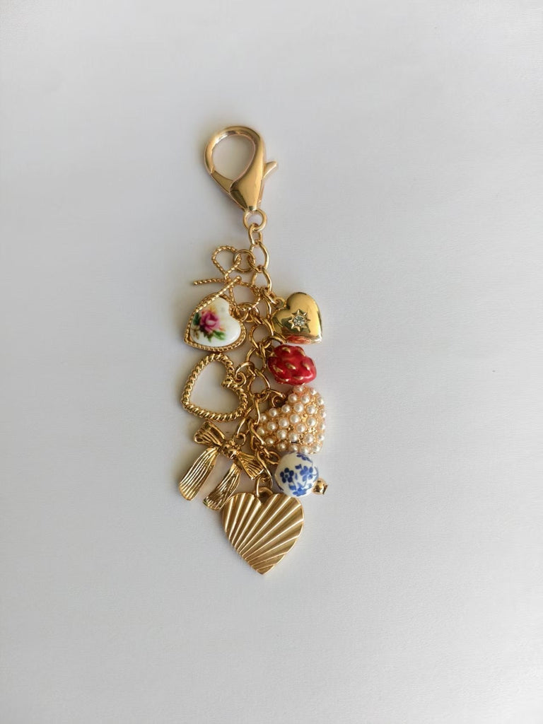 PORCELAIN BOWS HEARTS PEARL STRAWBERRY BAG CHARM | 80K008