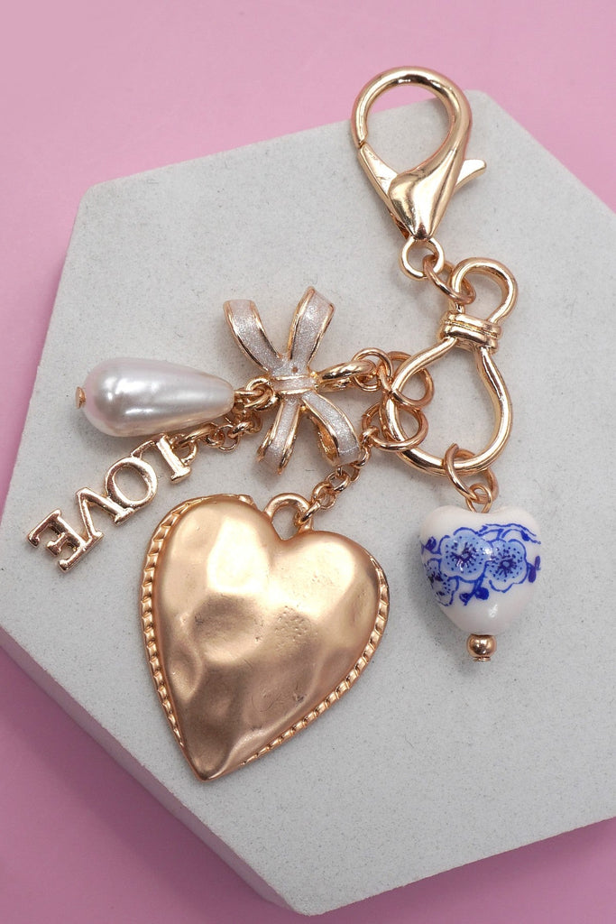 PORCELAIN BOW HEART LOVE BAG CHARM | 80K011
