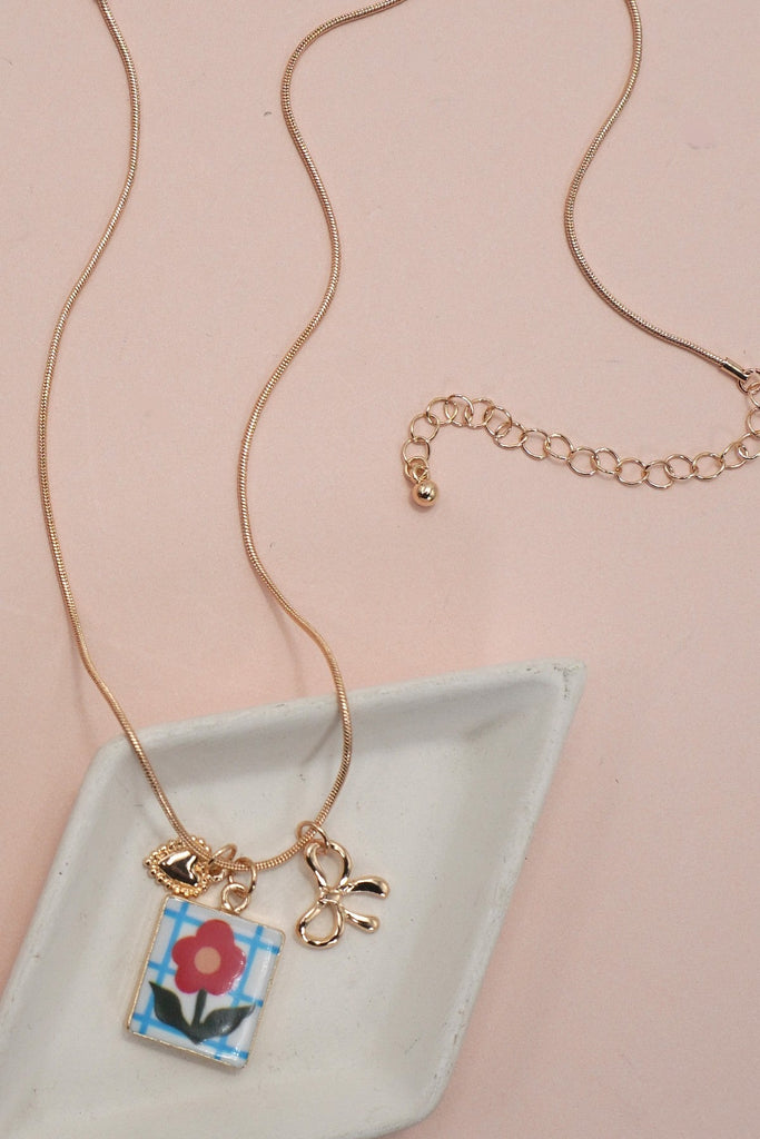 PORCELAIN CLUSTER CHARM BOW HEART NECKLACE | 80N91840