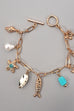 CHARM TOGGLE BRACELET-FISH CROSS CONCH PEARL | 80B1514