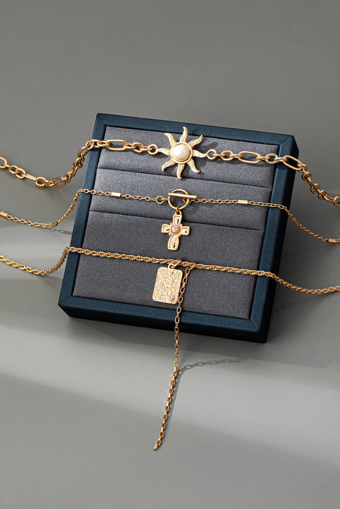 LAYER CELESTIAL CROSS SUN TOGGLE CHARM NECKLACE | 80N92500