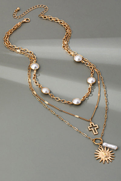 MULTI PEARL LAYER PEARL SUN CROSS CHARM NECKLACE | 80N92503