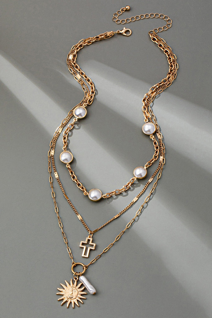 MULTI PEARL LAYER PEARL SUN CROSS CHARM NECKLACE | 80N92503
