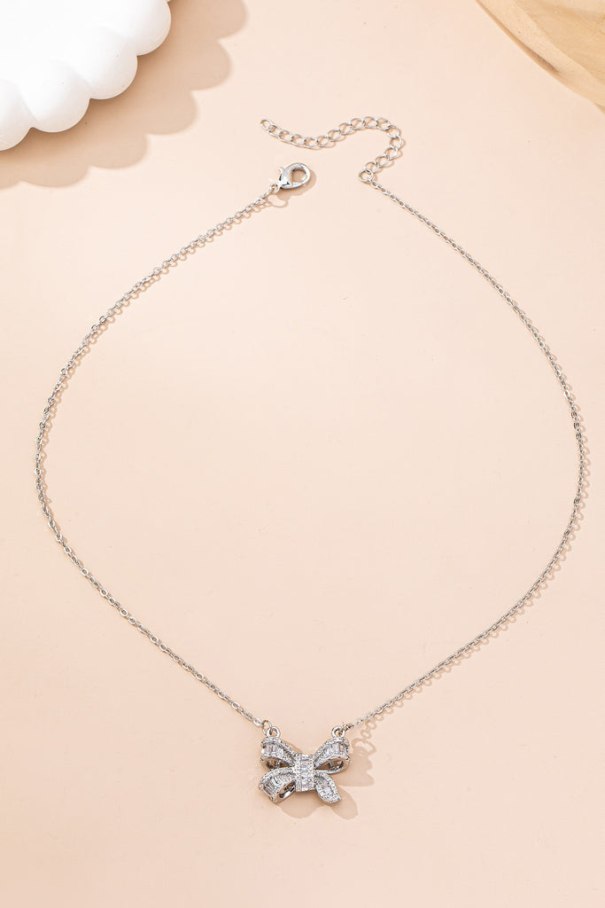 Sparkling Crystal Bow Pendant Necklace | 80N92845