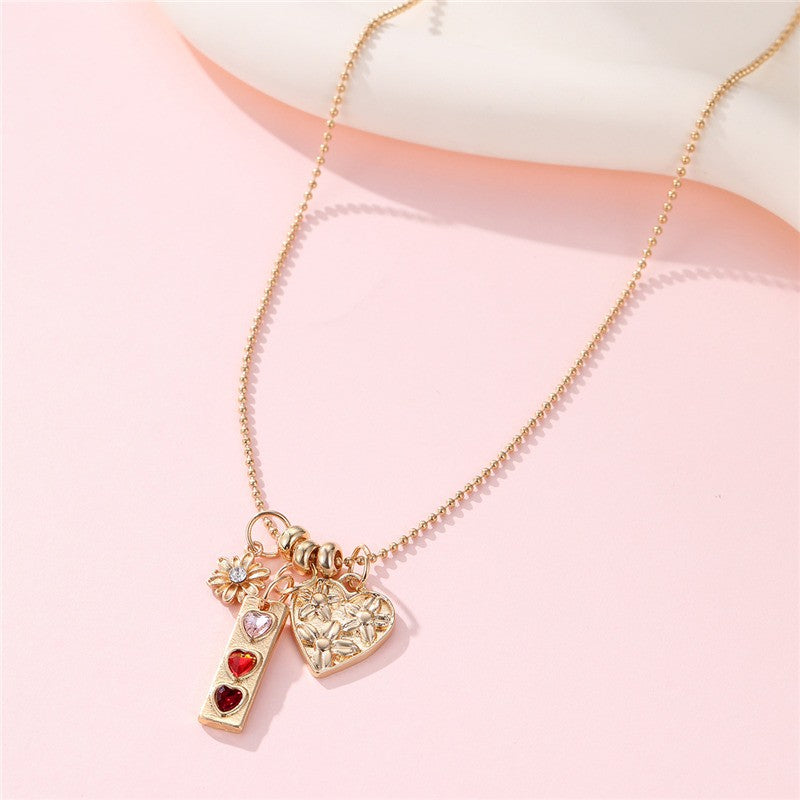 FLORAL HEART MULTI CHARM NECKLACE | 40NK9712