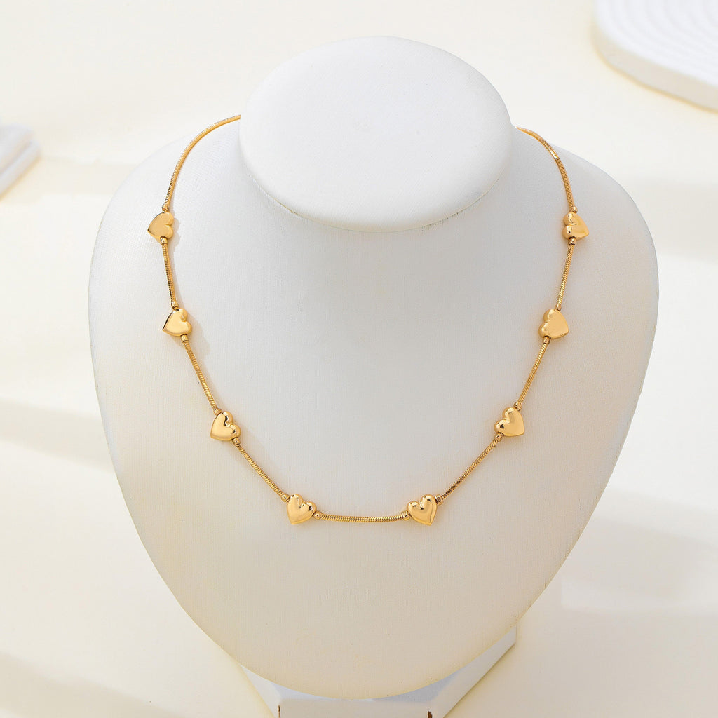 Dainty Gold Puffy Heart Station Necklace | 80N93588