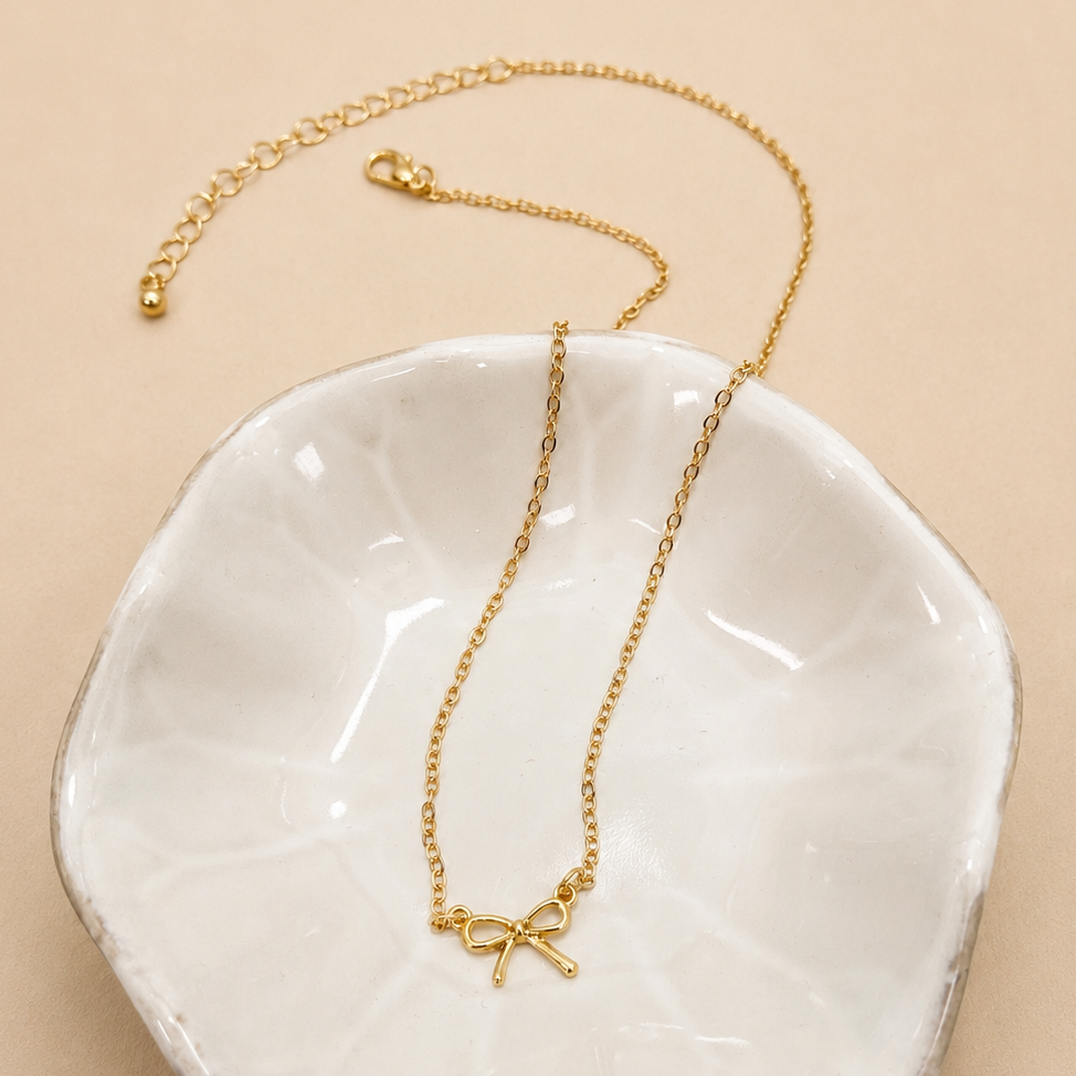 MINI GOLD BOW CHARM NECKLACE | 80N346