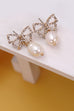 RHINESTONE BOW PEARL DROP EARRINGS | 10E3063029