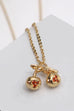 GOLD MINI CHERRY CHARM NECKLACE | 80N770