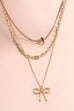 MULTI LAYER PEARL BOW CAHRM NECKLACE | 80N605