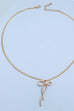 PEARL EMBELLISHED BOW PENDANT NECKLACE | 31N24080