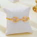 Horsebit Centerpiece Gold-Tone Bangle Bracelet | 80B1951