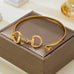 Horsebit Centerpiece Gold-Tone Bangle Bracelet | 80B1951