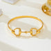 Horsebit Centerpiece Gold-Tone Bangle Bracelet | 80B1951