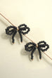 DOUBLE BEADED BLACK PEARL BOW EARRINGS | 80E06277