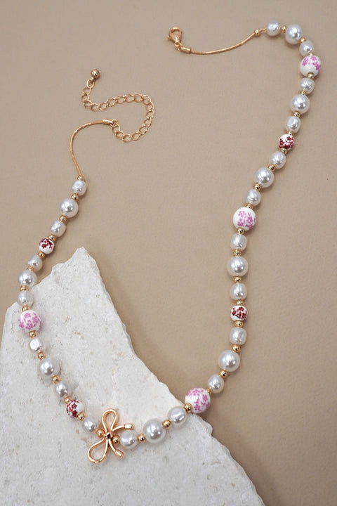 PINK CERAMIC PORCELAIN PEARL BOW NECKLACE | 80N91559