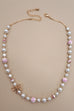 PINK CERAMIC PORCELAIN PEARL BOW NECKLACE | 80N91559