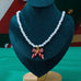 Holiday Red & White Striped Bow Pearl Necklace | 80N93905