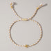 18K STAINLESS STEEL CORDED CROSS CHARM BRACELET | 40B5193