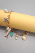 CHARM TOGGLE BRACELET-FISH CROSS CONCH PEARL | 80B1514