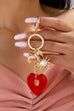 BAG CHARM KEY CHAIN-RESIN HEART DOG PEARL SUNBLAST | 80K092