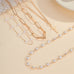 Layered Gold & Pearl Cross Statement Necklace Set | 40NK9673