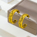 Western Icon Engraved Gold-Tone Hoop Earrings | 80E62385