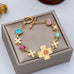 Floral Cross & Gemstone Charm Bracelet | 80B1836