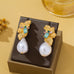Textured Gold Floral & Pearl Dangle Earrings | 80E62427