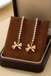 Crystal Pavé Linear Drop Earrings with Ribbon Bow | 80E62555