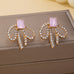 Emerald-Cut Pink Crystal Rhinestone Bow Earrings | 80E62598