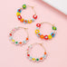 BOHO MULTI BEADED DAISY HOOP EARRINGS | 40E536