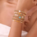 MULTI BALL PEARL BEAD CROSS STRETCHABLE BRACELET | 40B5271