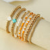 MULTI BALL PEARL BEAD CROSS STRETCHABLE BRACELET | 40B5271