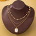 Layered Enamel Pearl & Rose Tag Pendant Necklace | 80N93573